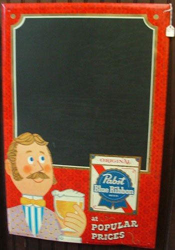 An advertising piece for Pabst used as a chalkboard to write specials/menu items.