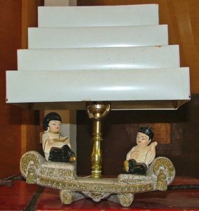 Oriental couple lounge on sofa of TV lamp - Bahoukas Antique Mall