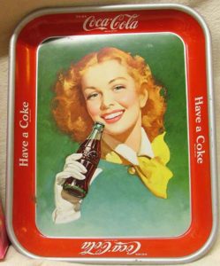 1950 Coca Cola advertising tray with a red-headed lady drinking a Coke