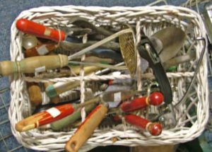 a variety of vintage kitchen utensils in a basket available at Bahoukas