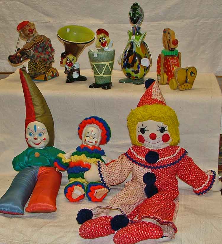 Back row: L-R clown playing violin, blown glass L-R Kinckerbocker stuffed clown, 2 other stuffed clowns, Czechoslovakian blown glass clowns, Sqeaky the clown pull toy
