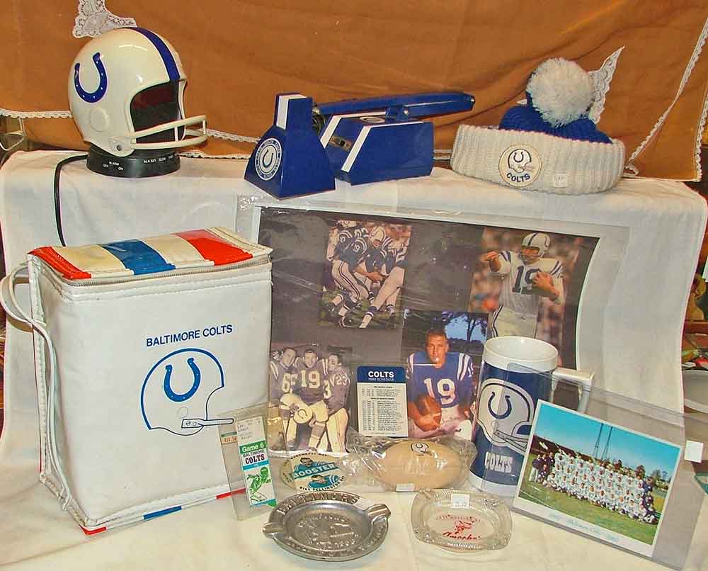 Baltimore Colts Memorabilia includes helmet clock, desk lamp, hat, 2-thermos insulated bag, Johnny Unitas signed photo, 1960s Christmas card, 1982 ticket stub, booster pin, 1980 schedule, beer mug, NFL Champions 1958, Ameche's ash tay w/Colt's logo all available at Bahoukas
