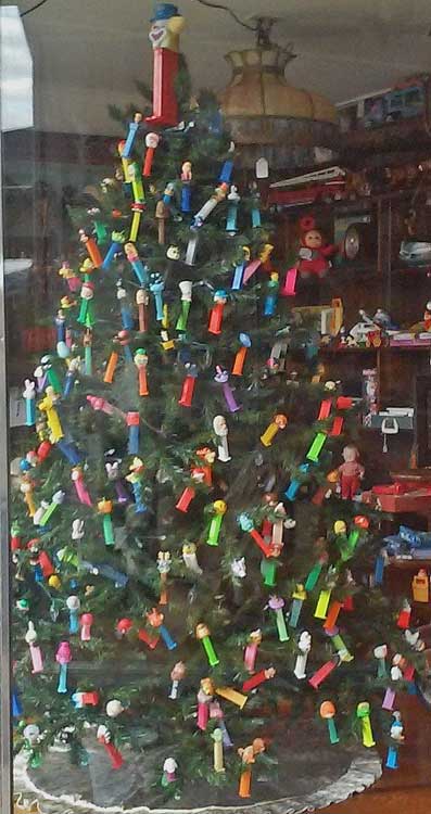 Christmas Tree decorated with PEZ Dispensers in window at Bahoukas Antique Mall in Havre de Grace
