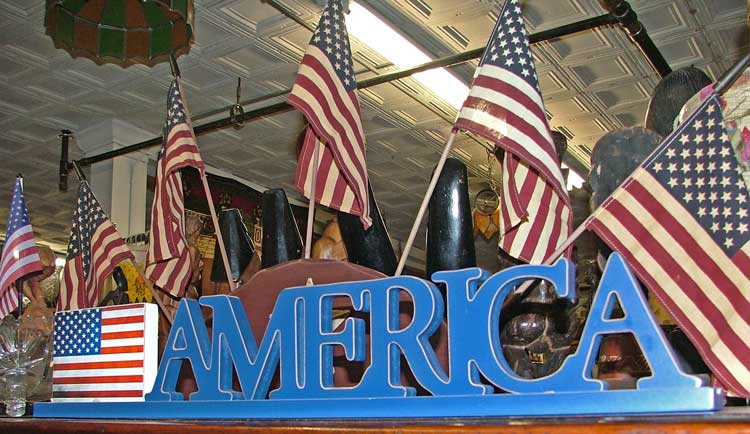 Flags, AMERICA sign, and more Military items at Bahoukas in Havre de Grace