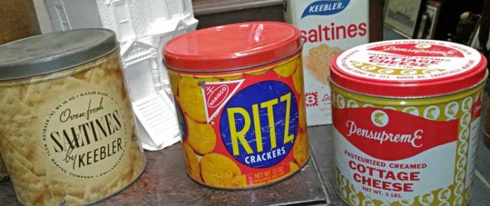a selction of  tin cans with advertising, Saltines by Keebler, Ritz Crackers, Pensupreme Cottage Cheese