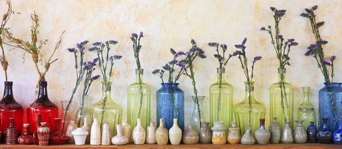 The whimsy of summer flowers in a variety of collectble, colored jars at Bahoukas in Havre de Grace