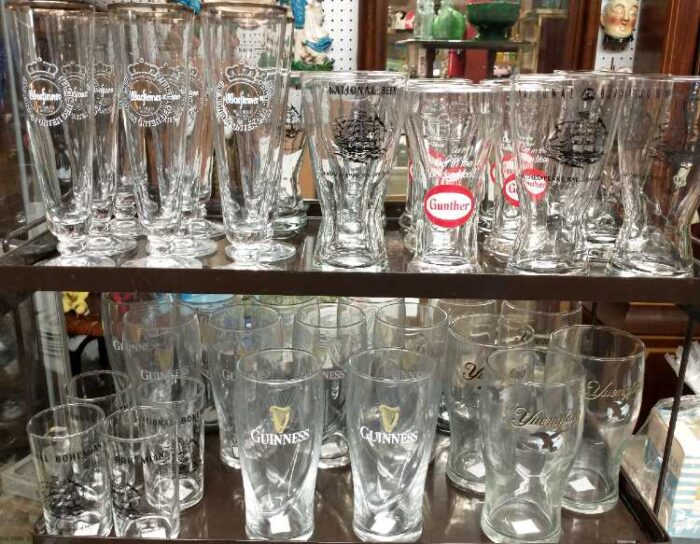 Collection of beer glasses including Gunther, Guinness, Yuengling, and more.