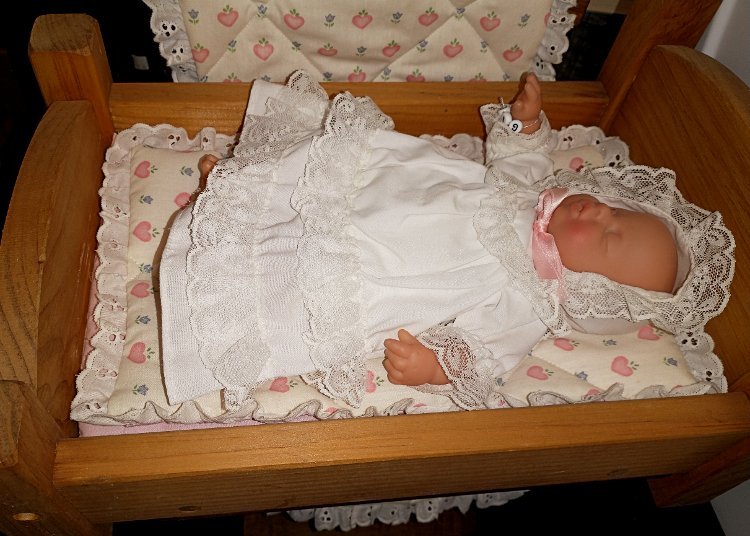 12-tiny-doll-and-cradle