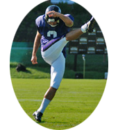 football player kicking football