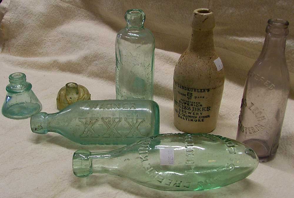 vintage bottles including torpedo, igloo ink, blob top, crown top, and a clay Weiss Beer bottle - all available at Bahoukas Antiques in Havre de Grace, MD