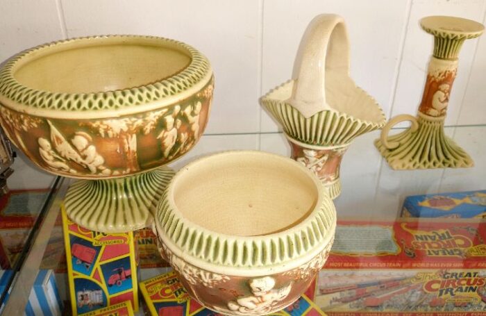 Donatello pieces by Roseville Pottery, c. 1920s - bowls, pottery basket, candle holder - these and more available at Bahoukas.