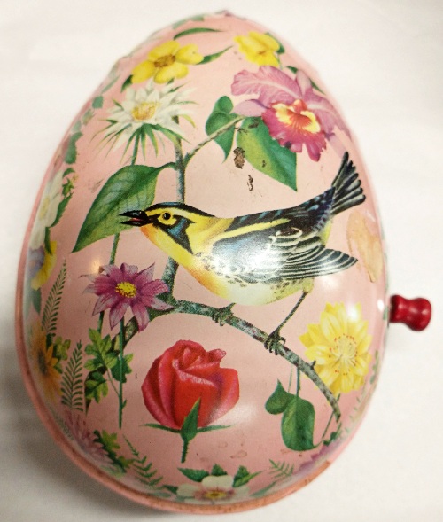 egg-shaped, painted, metal, handcrank music box at Bahoukas