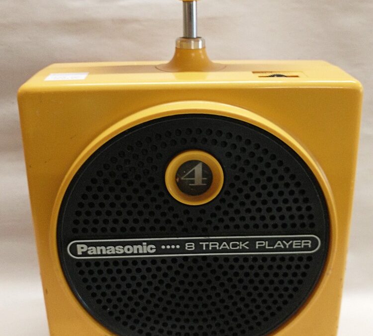 the yellow Dynamite Panasonic 8-track player -