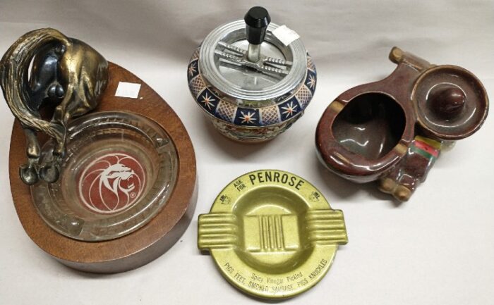 variety of collectible ashtrays