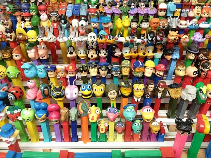 Picture of 'part' of a huge assortment of PEZ dispensers