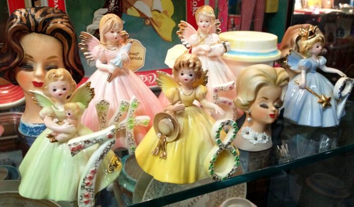 sampling of Josef Originals birthday angels figurines and Lady Head vases