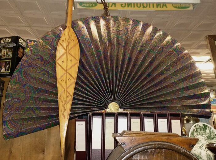 wood wall art and huge folding fan for wall decor