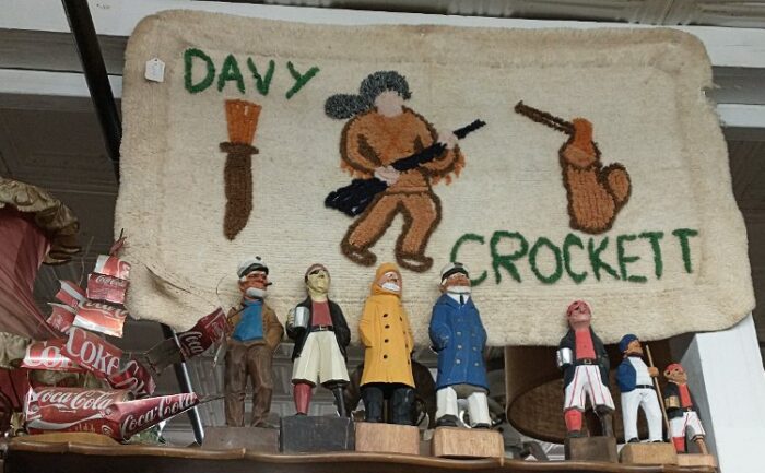 Nautical figures and a Davy Crockett embroidered piece
