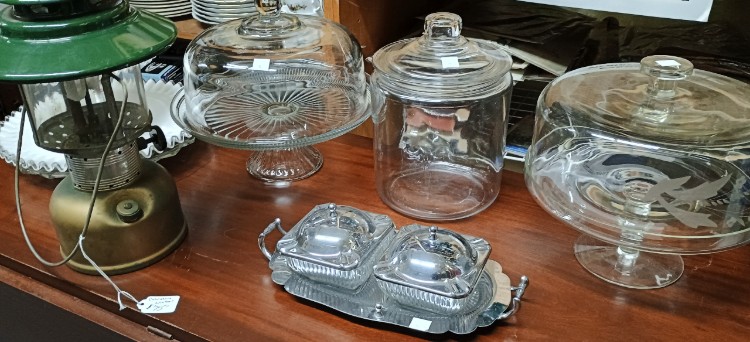 Beautiful covered glass cake plates, green oil lamp, and beautiful condiments set available at BAHOUKAS ANTIQUE MALL in Havre de Grace, MD