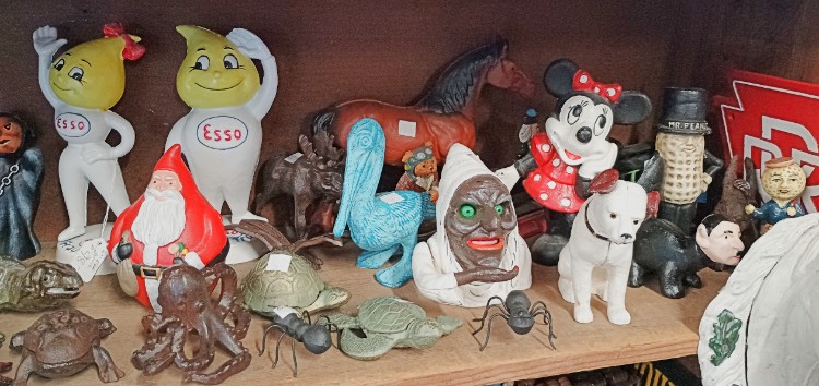 An amazing assortment of cast iron figures from crabs and crocodiles to mermaids and Black Memorabilia and everything in between at BAHOUKAS ANTIQUE MALL in Havre de Grace MD