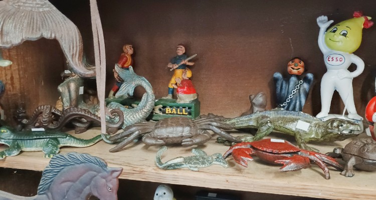 An amazing assortment of cast iron figures from crabs and crocodiles to mermaids and Black Memorabilia and everything in between at BAHOUKAS ANTIQUE MALL in Havre de Grace MD