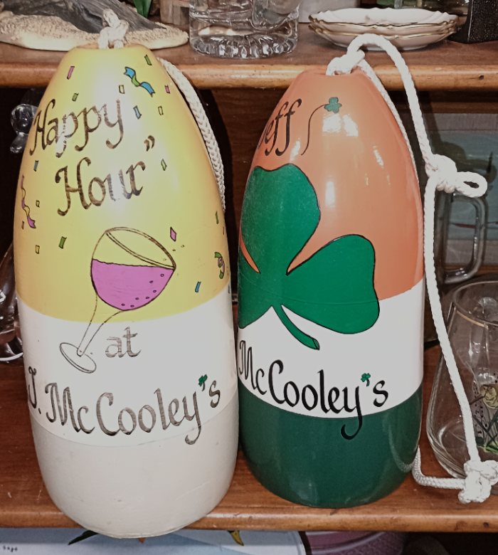 2 painted buoy's from McCooley's - available at BAHOUKAS ANTIQUE MALL