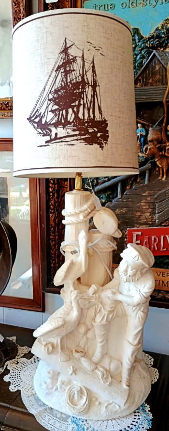 Exquisite lamp with sailing vessel on the lamp shade and a superb carved base featuring a waterman, available at BAHOUKAS ANTIQUE MALL in Havre de Grace MD