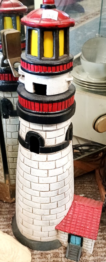 Cast iron lighthouse to decorate your waterfront living space available at BAHOUKAS ANTIQUE MALL in Havre de Grace