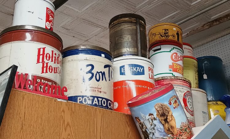 a sampling of large potato chip tins and more - part of the 'Collections' that can be found at BAHOUKAS ANTIQUE MALL in Havre de Grace MD