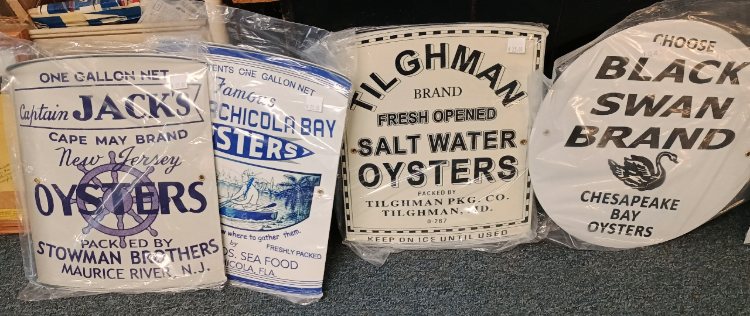 Metal copies of oyster tins signs available at BAHOUKAS ANTIQUE MALL in Have de Grace.