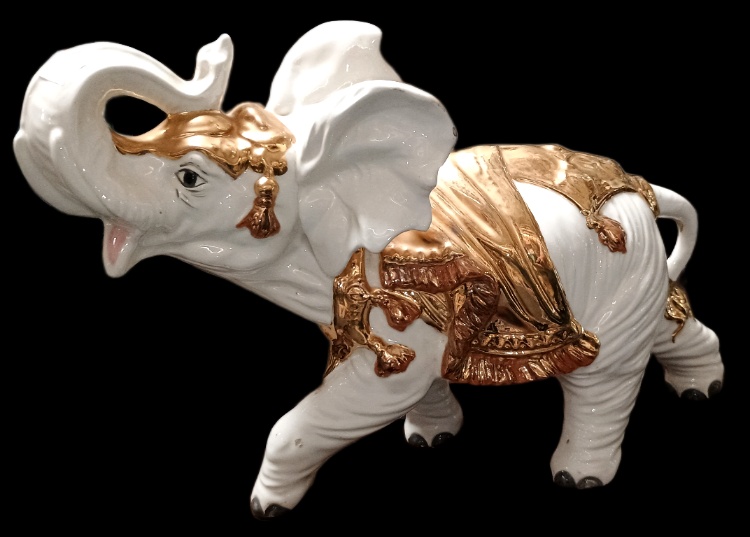 Beautiful large porcelain white elephant with gold accents available at BAHOUKAS ANTIQUE MALL in Havre de Grace, MD.