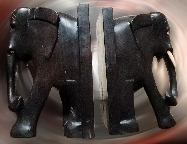 Carved elephant bookends available at BAHOUKAS ANTIQUE MALL in Havre de Grace, MD.