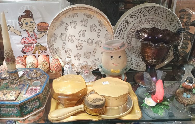 A beautiful vanity table set, a bag from BIG BOYS restaurant, platters and more - available at BAHOUKAS ANTIQUE MALL in Havre de Grace, MD