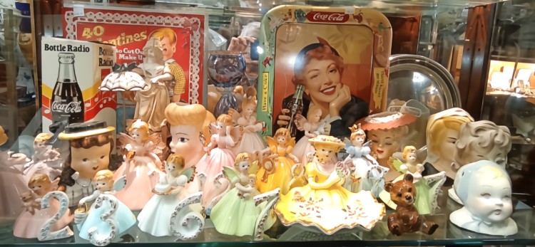Lady head vases, small fairy dolls with numbers - perfect for birthday cakes for a little girl, small trays and a bottle CoCa-Cola radio - available at BAHOUKAS ANTIQUE MALL in Havre de Grace, MD