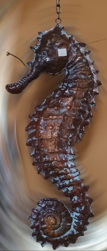 A stunning copper Seahorse hanging from a cast-iron bracket available at Bahoukas Antique Mall in Havre de Grace MD