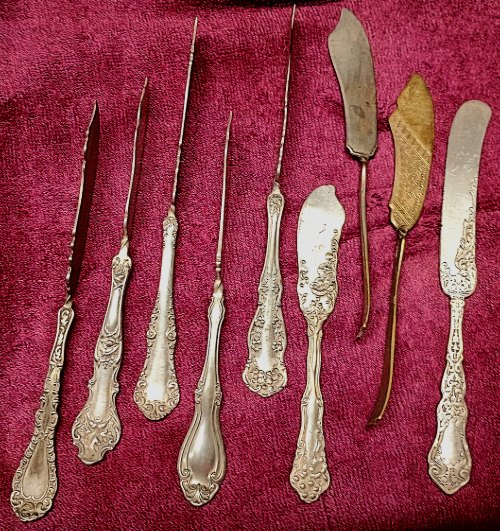 silver plated butter knives among many at BAHOUKAS ANTIQUE MALL in Havre de Grace
